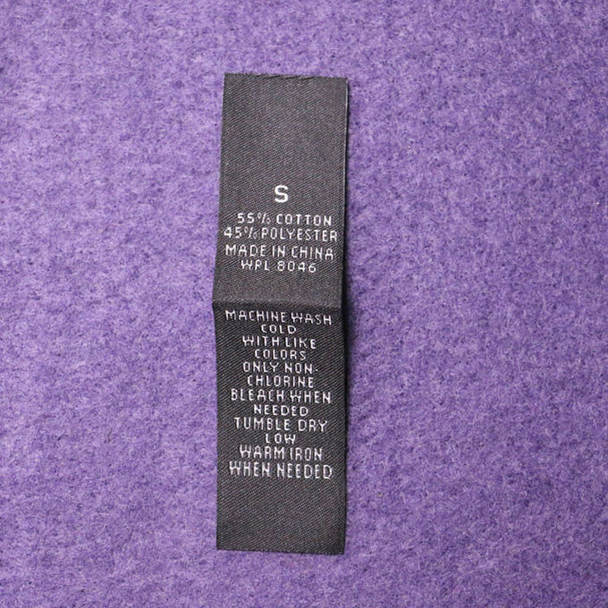 La dimensione di cucito delle etichette tessuta damasco del popolare dell'estremità etichetta il fondo bianco con testo nero